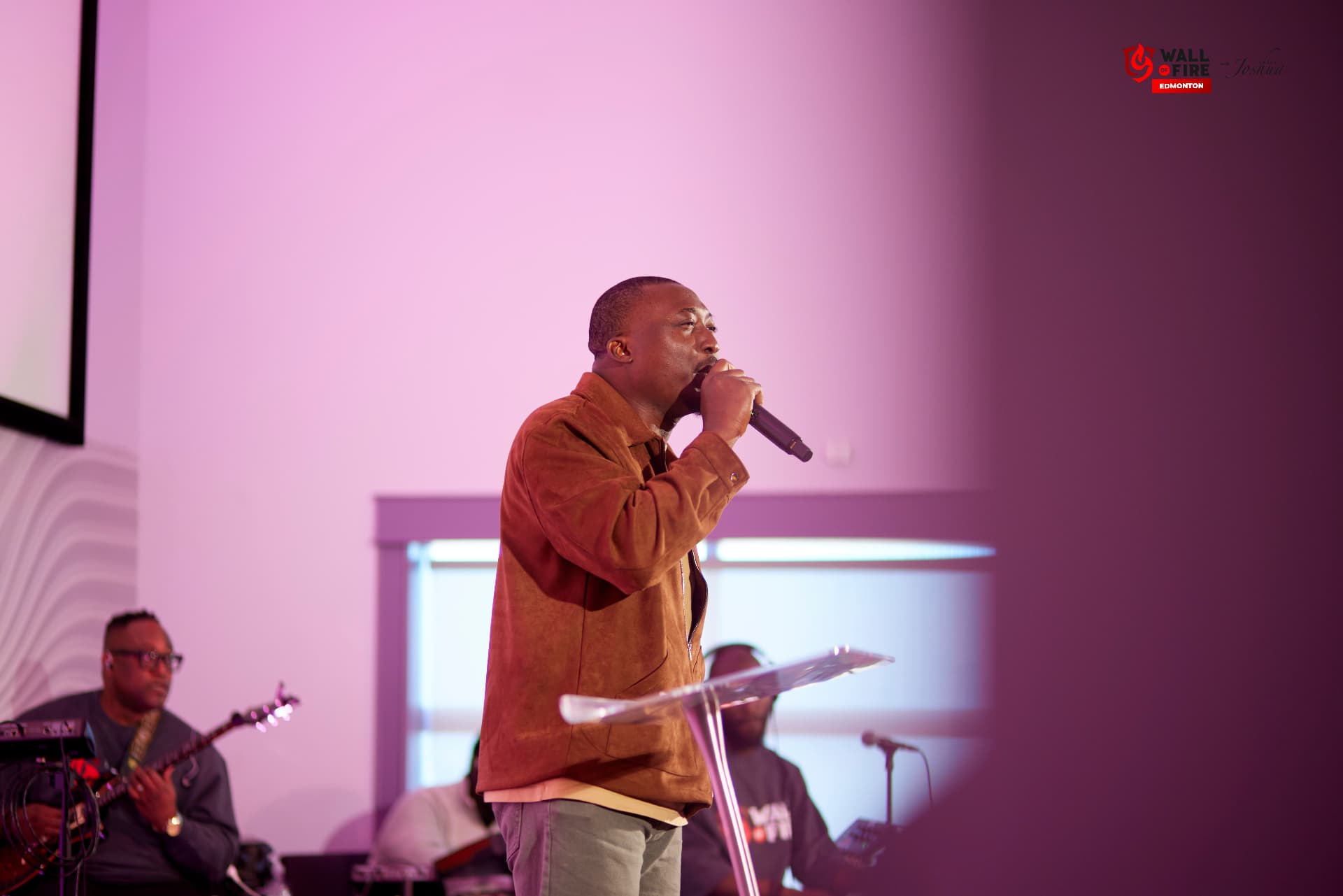 A worship leader ministering on stage